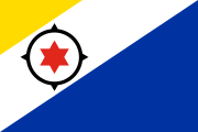 diagonal yellow-white-blue, red 6-pointed star, black compass