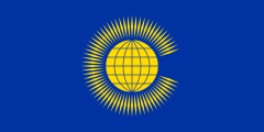 blue, yellow globe surrounded by rays in the shape of a C